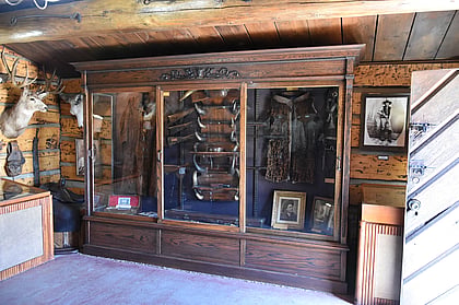 Museum cases inside historic cabin near Cody Wy
