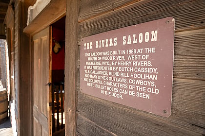 A sign indicating the origin of the saloon and the people who patroned it
