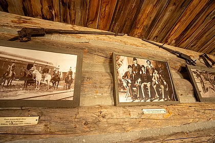 Frontiersmen featured in photos next to time period rifles